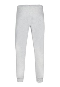 Grey sweatpants with a soft texture, featuring an elastic waistband and cuffs. Notable detail: a tricolor accent on the waistband.