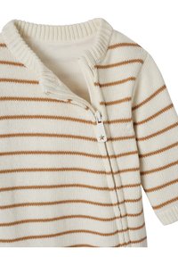 Knitted garment with a cream base and brown stripes. Features a zip closure, ribbed collar, and textured fabric. Long sleeves.