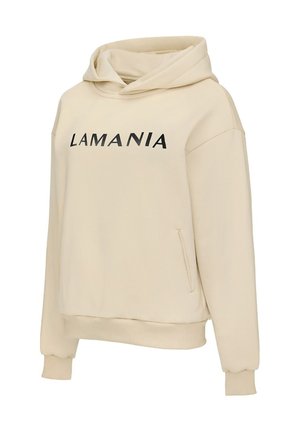 Béžová mikina s kapucňou vo voľnejšom strihu, čierny nápis "LAMANIA" na hrudi, rebrované manžety a pripojená klokania vrecko.