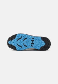 Sport shoe outsole featuring a black rubber edge, a textured light blue midsole with a zigzag pattern, and a logo in the center.