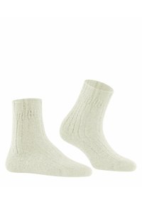 Calzini alla caviglia beige chiaro con una texture a coste, caratterizzati da delicate variazioni di colore per un tocco di dettaglio. Materiale di maglia. Spessore medio.