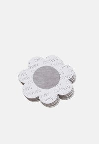 Flower-shaped paper cutouts in white with a textured center, featuring repeated "magic" text pattern, stacked with rounded edges.
