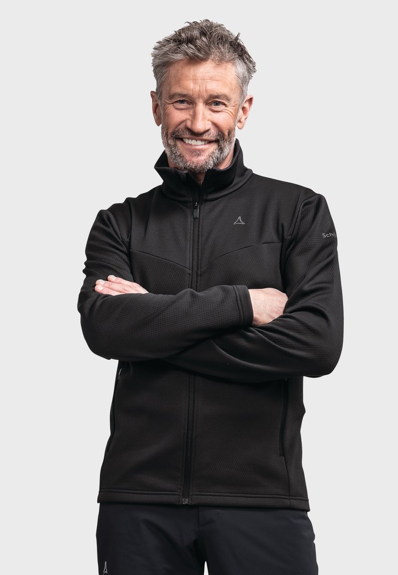 Schwarze Fleecejacke mit hohem Kragen, Reißverschluss vorne und strukturiertem Stoff. Sie bietet ein elegantes Design mit kontrastierenden Nähten und Seitentaschen.