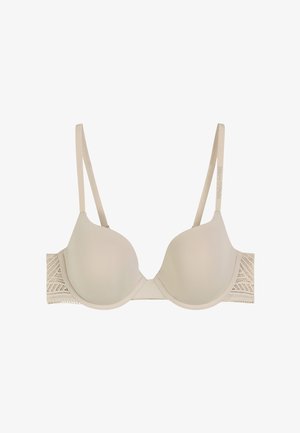 Reggiseno beige con coppe preformate, spalline regolabili e un bordo in pizzo testurizzato con un motivo geometrico sui lati.