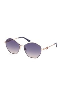 Occhiali da sole esagonali con lenti viola sfumate, montatura in metallo dorato e aste in acetato blu con dettaglio del logo.