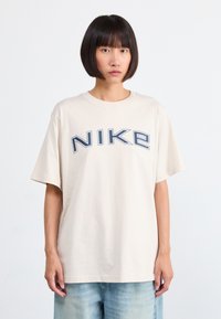 Nike Sportswear PHOENIX TEE - Camiseta estampada - orewood