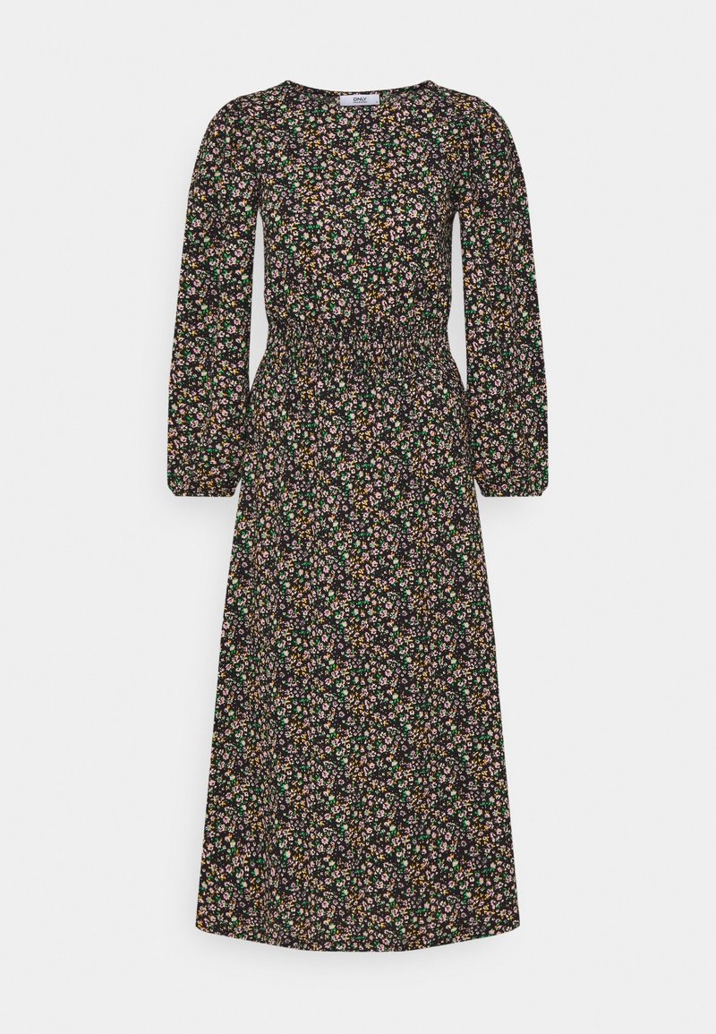 Robe noire à manches longues avec un motif floral en rose, vert et jaune. Présente une taille smockée et une jupe fluide.