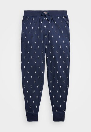 Calças de pijama azul marinho com cintura elástica, cordão e padrão repetido de logotipo branco de polo por toda a parte. Design de perna afunilada.