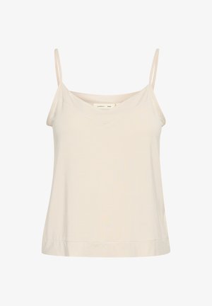 Camisole beige clair en tissu doux, avec de fines bretelles réglables et un décolleté en V, offrant une coupe légèrement décontractée.