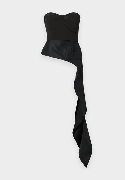 Juodas besijungiantis viršus su prigludusia palaidine, platėjančia apatine dalimi ir ilgu, draped, asimetriniu kraštu. Lygi, matinė tekstūra visame paviršiuje.