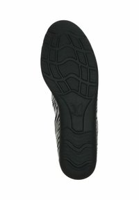 Semelle de chaussure en caoutchouc noir avec un motif texturé comportant des rainures en forme de vagues et un logo de papillon, conçue pour l'adhérence et la stabilité.