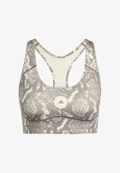 Sports bra in a snake print pattern, featuring a light cream and gray color scheme, racerback design, and a circular logo at the center.