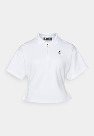 Hvit kortermet polo-skjorte med glidelåskrage, korte ermer og logo på brystet. Laget av et glatt, pustende stoff.