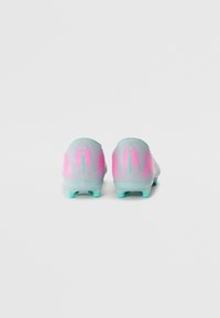 Football cleats in mint green and pink, featuring a textured upper with stripes, rounded toe, and molded studs for traction.