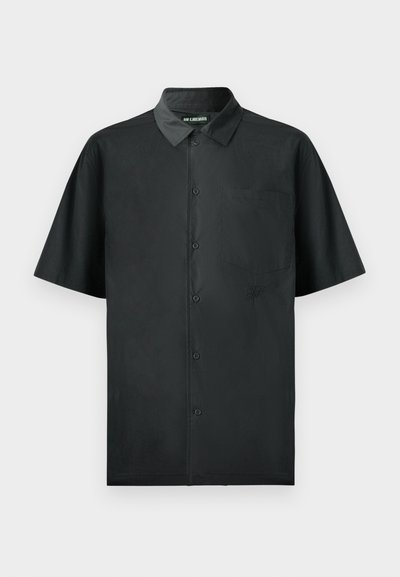 Short-sleeve black button-up shirt made of smooth fabric, featuring a single chest pocket and subtle embroidered detail on the front.