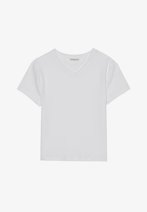 Λευκή κοντομάνικη μπλούζα V με ριμπ ύφασμα. Διαθέτει καθαρό σχέδιο με ευθύ στρίφωμα και ελάχιστες λεπτομέρειες.