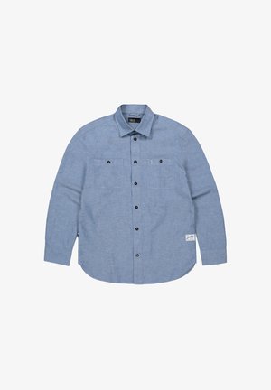 Lichtblauw overhemd met lange mouwen, een button-down kraag, twee borstzakken, zwarte knopen en een klein logo op de zoom.