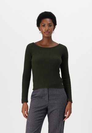 Dark green ribbed knit sweater with a wide neckline, long sleeves, and a fitted silhouette, paired with textured gray trousers.