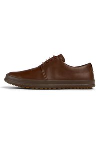 Brown leather shoes with a smooth finish, rounded toe, and minimalistic design. Features brown laces and a flexible, textured rubber sole.