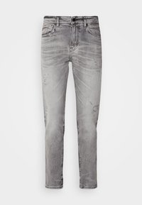 Jeanși din denim gri, cu o croială slim, având un finisaj decolorat, ușoare uzuri, design cu cinci buzunare și închidere cu buton.