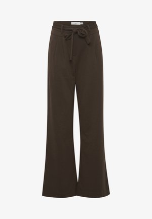 Szerokie spodnie w ciemnym brązie, wykonane z miękkiego materiału, związywanym paskiem, plisami z przodu i luźnym krojem.