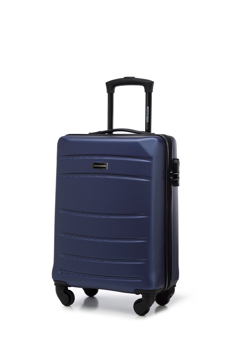 Hard-shell carry-on suitcase in navy blue, featuring a textured surface, retractable handle, and double spinner wheels for mobility.