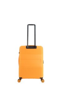 Orange hard-shell suitcase with ridged texture, black telescopic handle, and four wheels. Zippered closure with side handle.