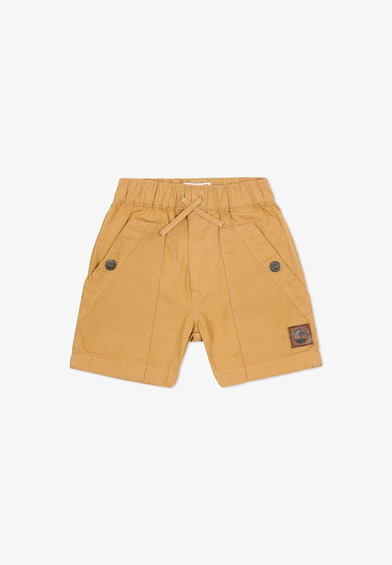 Shorts kaki avec une ceinture élastique, un cordon de serrage, deux poches avant et un patch logo marron sur le côté gauche. Texture lisse.
