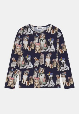 Long-sleeve navy shirt patterned with cats, dogs, rabbits, guinea pigs, and birds wearing colorful knit hats and accessories.