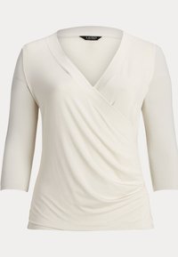 Vit långärmad omslagstopp med djup V-ringning och draperad front. Mjuk tyg med slät yta och subtil töjbarhet. Märke: Lauren.