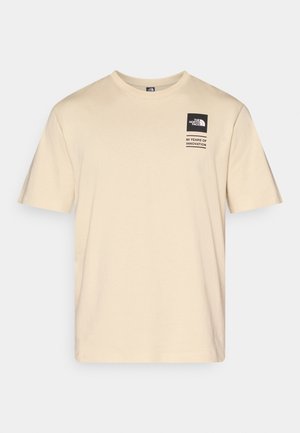 Beige cotton t-shirt with short sleeves, round neckline, and black branded patch featuring text "60 Years of Innovation."