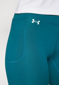 Under Armour Leggingek - hydro teal/white