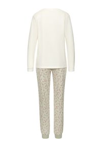 Langemouwen crème bovenstuk en lichtgrijze broek met een zuurstokkenpatroon. Beide hebben een zachte textuur en elastische manchetten bij de taille en enkels.