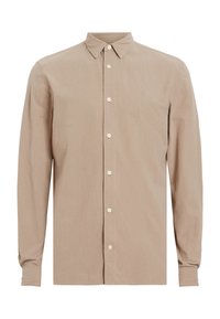 Camisa beige de manga larga en un tejido suave. Presenta un cierre de botones en la parte delantera, cuello de punta y un pequeño acento bordado en el pecho.