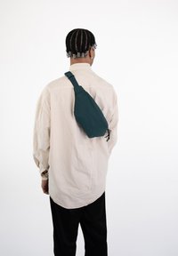 Johnny Urban RILEY - Bältesväska - teal