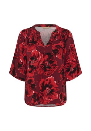 Blusa rossa con grande motivo floreale in rosso scuro e nero, maniche a tre quarti e scollatura a V con dettagli arricciati sulle spalle.