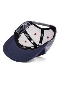 Navy blue cap with a curved brim, mesh paneling, white lining, and red accents. Interior features branding and a patterned design.