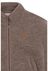 Braune Wollmischungjacke mit Reißverschluss, hohem Kragen und einem kleinen Lederetikett. Weiche Textur mit tonalem Nähen und Seitentaschen.