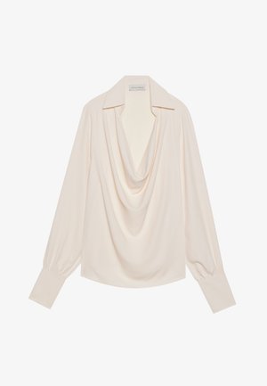Blouse à manches longues et col cheminée en tissu crème clair, avec une coupe décontractée, des poignets roulés et un drapé sans couture au niveau du col.