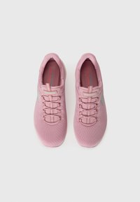 Pink athletic shoes made of mesh material. Features include a rounded toe, elastic laces, and a cushioned insole with branding in blue.