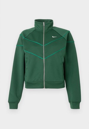 Veste zippée Nike vert foncé avec col montant, manches longues, poches latérales et détails de piping teal clair sur la poitrine et les épaules.