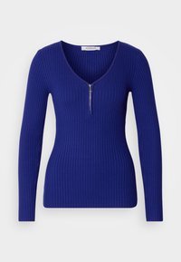 Pull bleu côtelé à manches longues avec fermeture éclair à l'avant et col en V, coupe ajustée, avec une étiquette de la marque Morgan à l'intérieur du col.