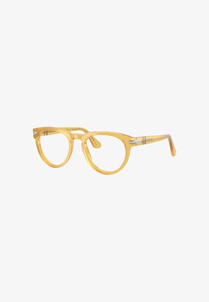 Lunettes œil de chat jaunes avec montures transparentes, fines accents argentés et verres arrondis. Le design est léger avec une texture lisse.