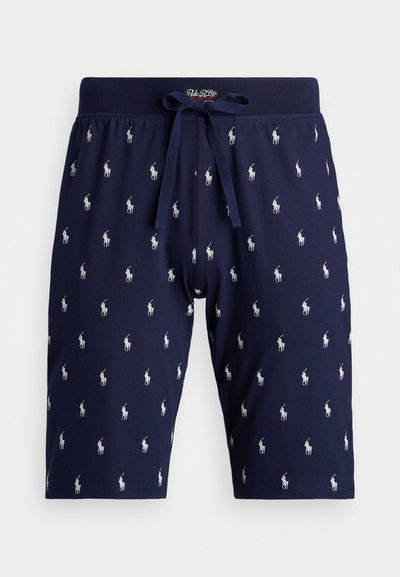 Navy blue cotton shorts featuring a repeating white embroidered polo logo pattern, with a drawstring waistband and mid-thigh length.