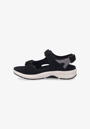 Black sandal with adjustable straps, suede and mesh materials, cushioned footbed, and contrasting white sole featuring textured grip.