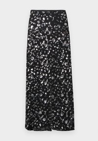 Must seelik hõbedase litritrükitusega. Omab sirget disaini ja eesmist lõhikut, mis loob läikiva tekstuuri.