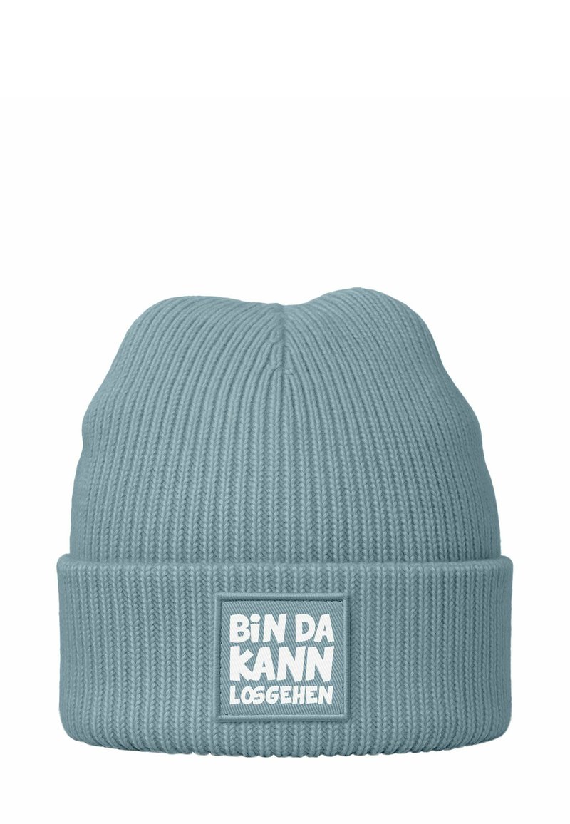 Blue knitted beanie with ribbed texture and a folded cuff featuring a rectangular patch with white text: "BIN DA KANN LOSGEHEN."