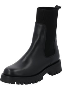 Svart läderankelboot med ribbat svart elastiskt panel, kraftig svart sula med djupa spår, rund tå och subtilt varumärkesdetalj.