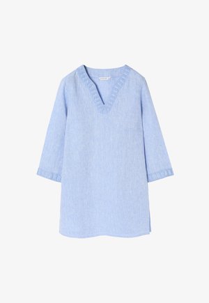 Tunika in lino azzurro chiaro con scollatura a V, maniche a tre quarti e cuciture decorative al collo e ai polsini. Taglio semplice e rilassato.