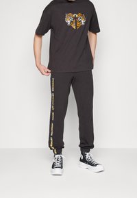 Puma Triko s potiskem - black